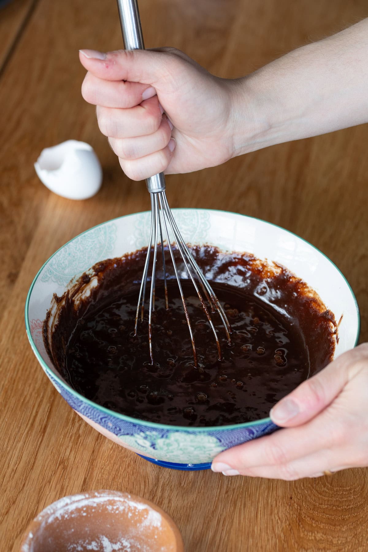 Mixing brownie batter by hand.