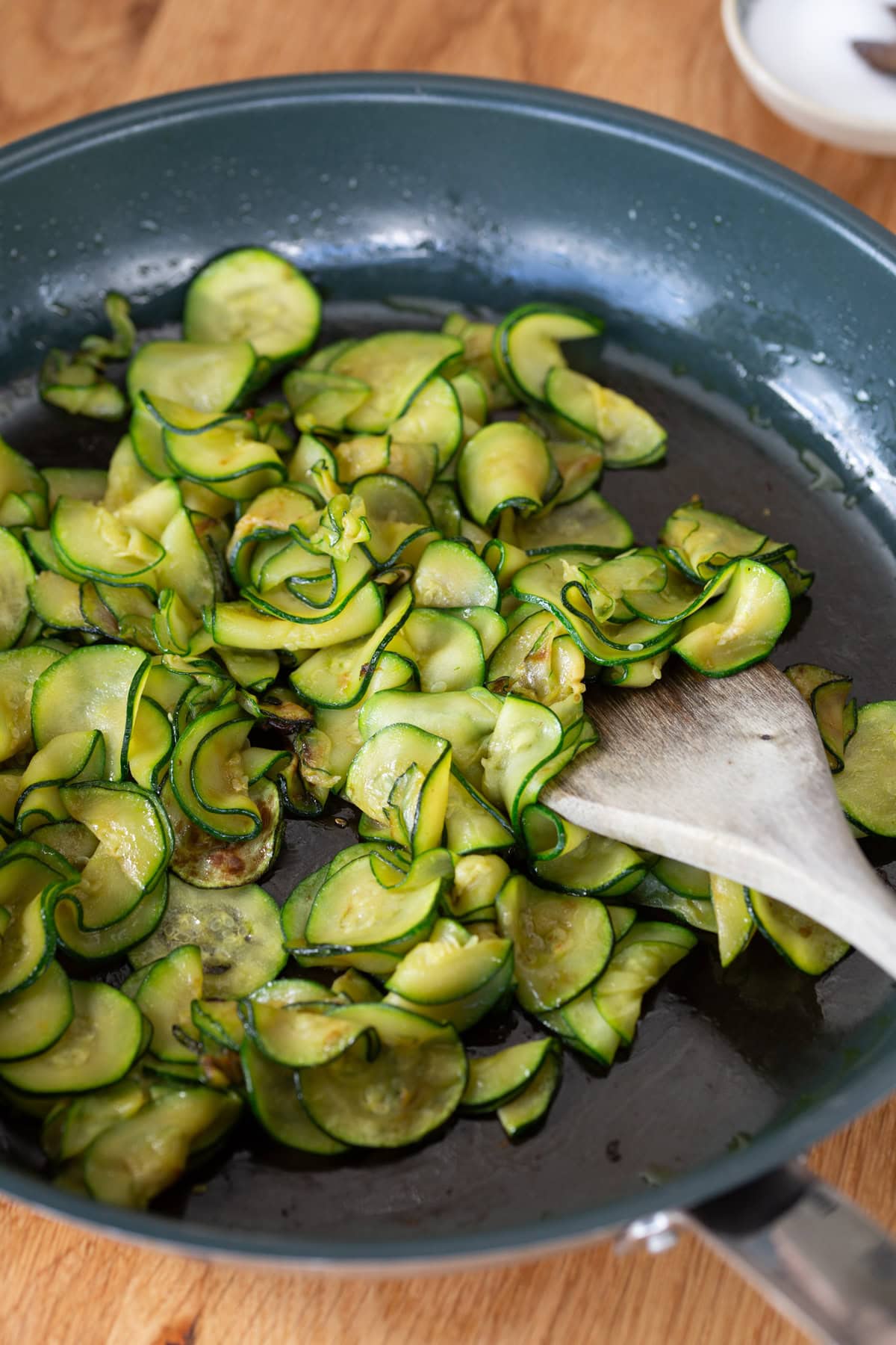 Sauteed zucchini in a skillet.