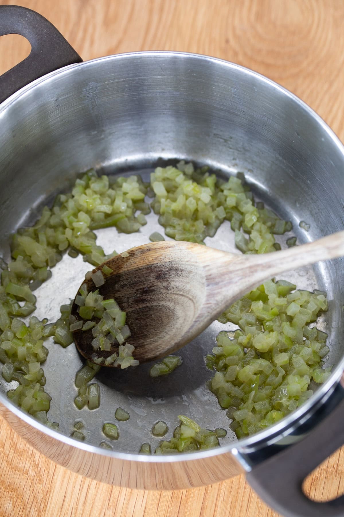 Minced onion sauteed in a pot.