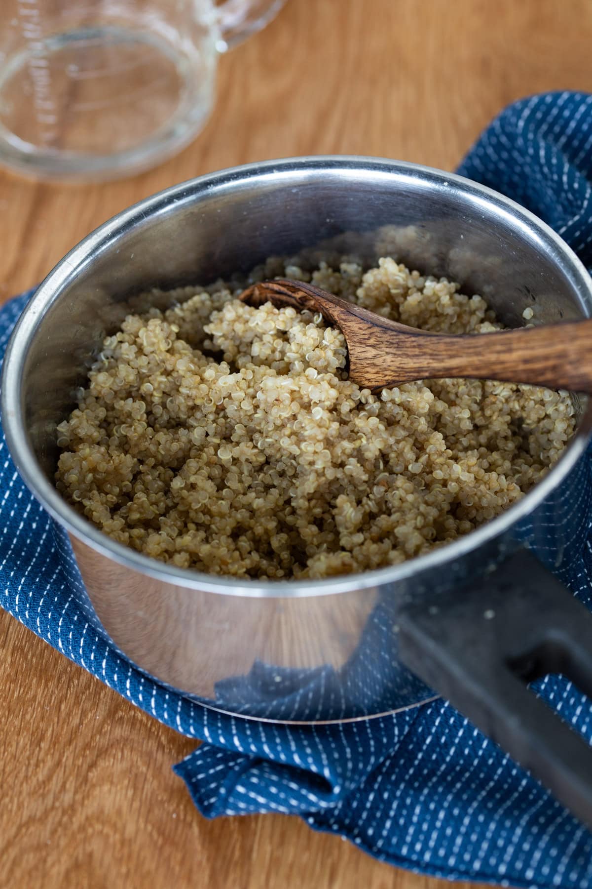 Cooked quinoa in a small pot.