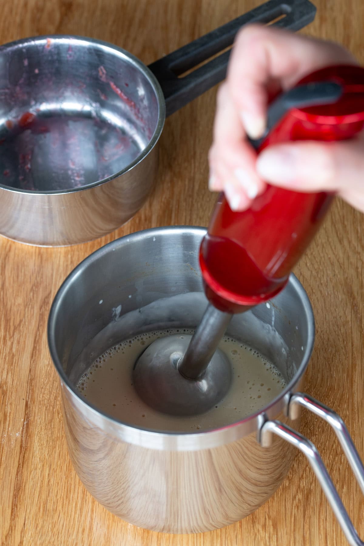 Blender going into pan with panna cotta.