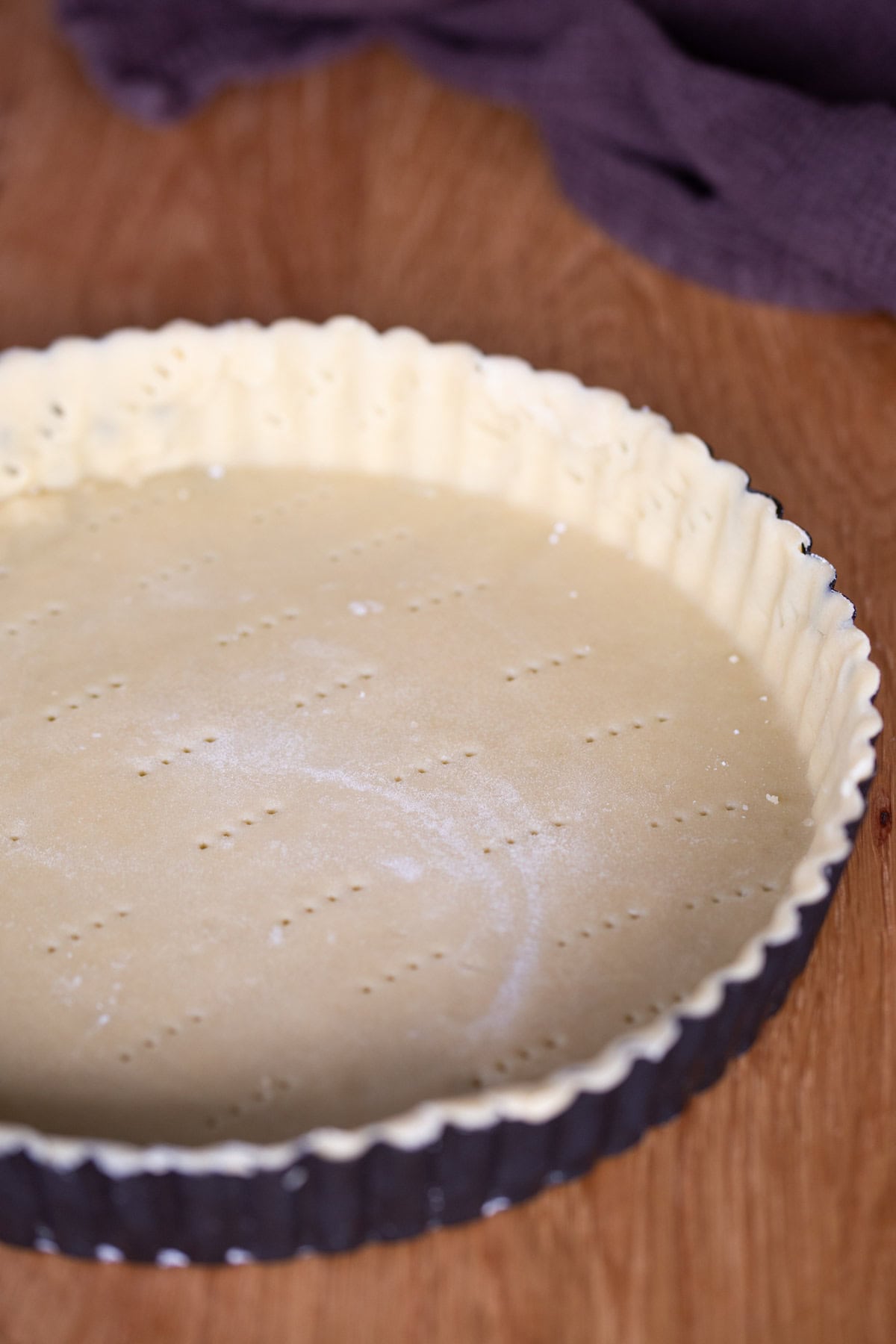 Shortcrust pastry rolled out in a tart pan.