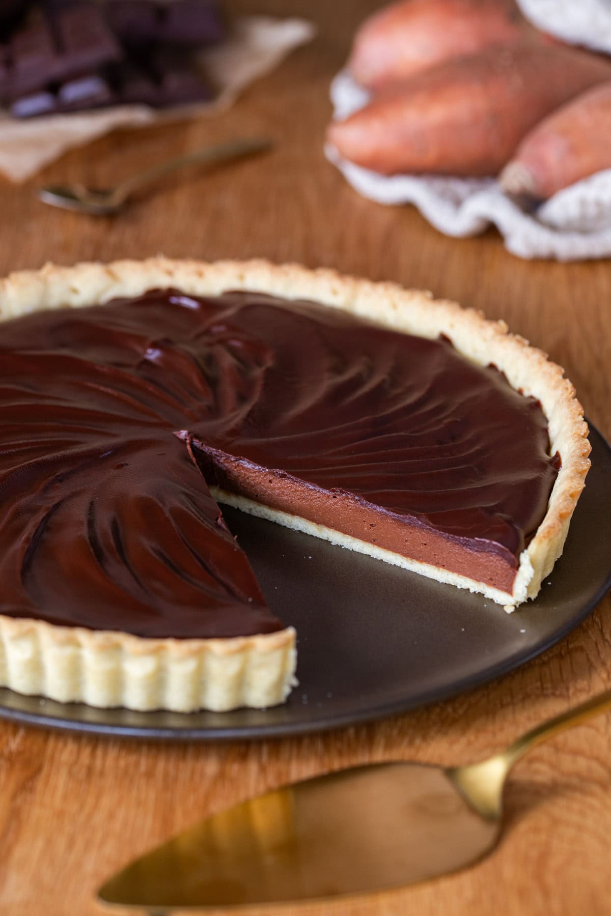 Chocolate sweet potato pie sliced to show the layers and textures.