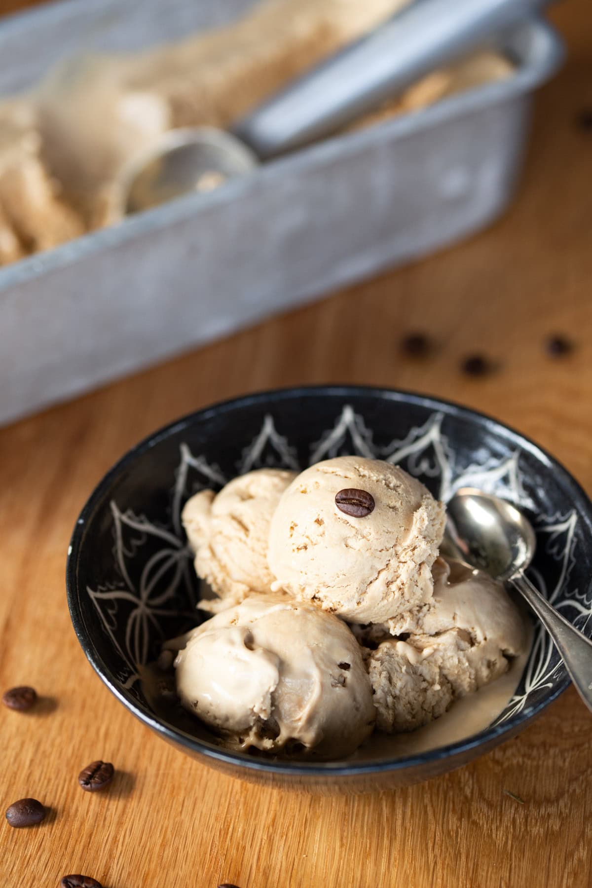 A portion of no-churn coffee ice cream in a black bowl.
