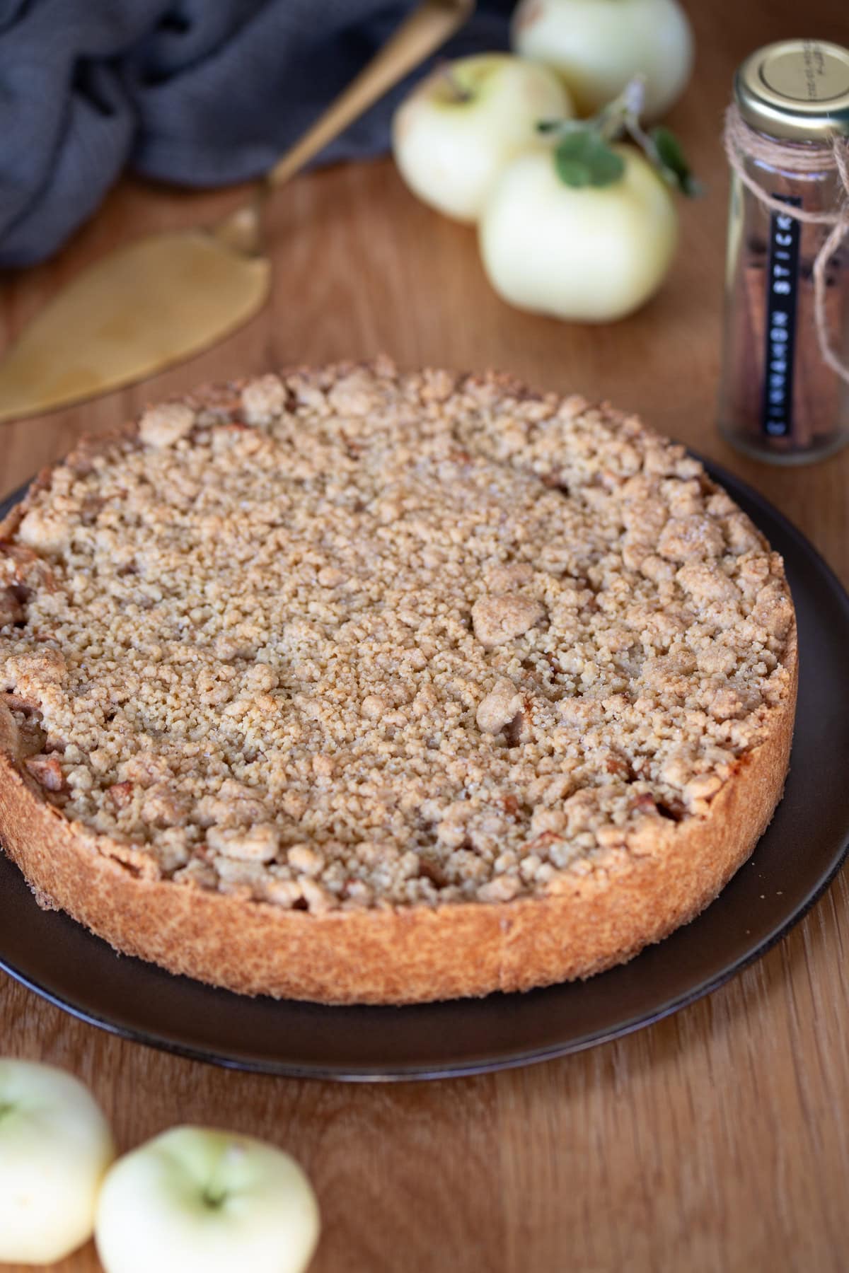 Polish apple pie Szarlotka on a brown serving plate.