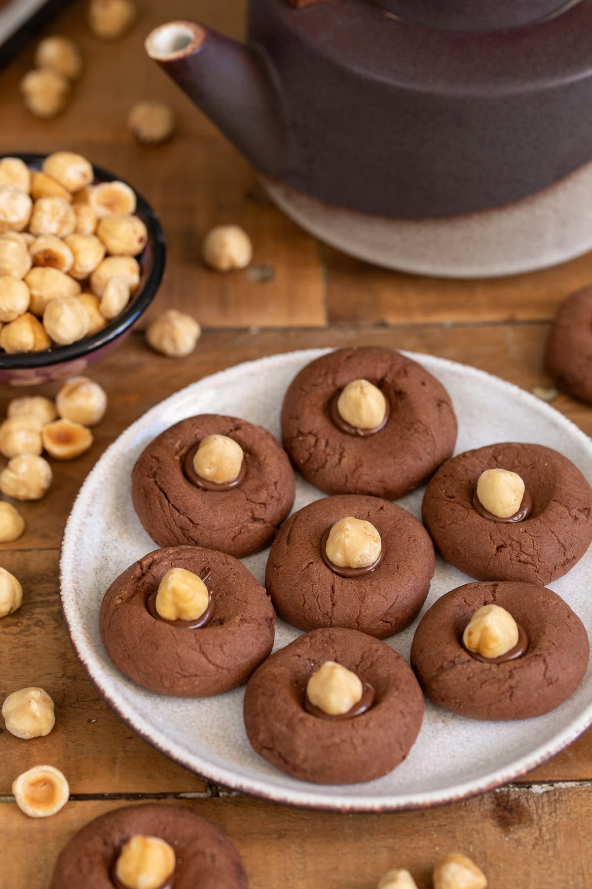 Nutella thumbprint cookies - nutellotti - served on a white plate.