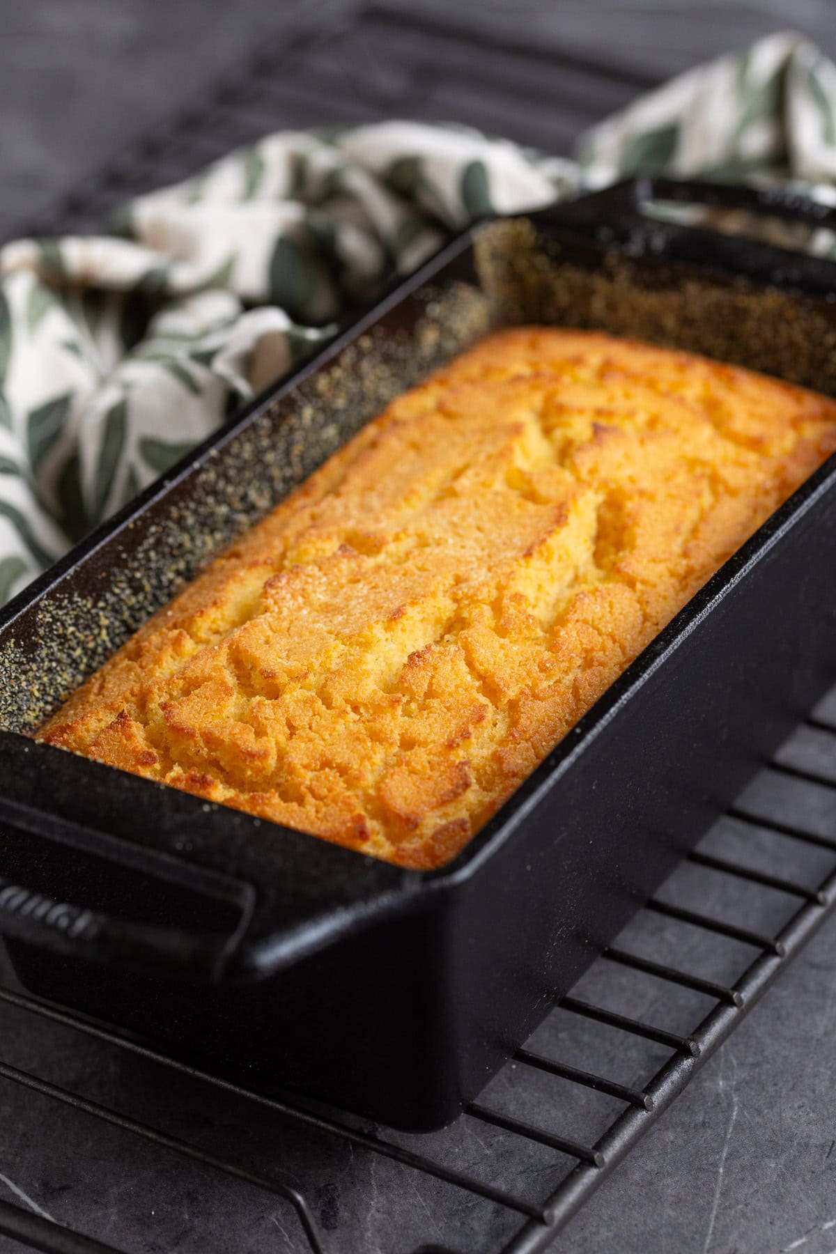 Polenta cornbread in a cast iron loaf pan.